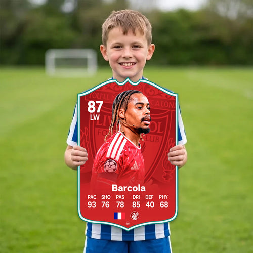 Kid holding the Bradley Barcola Liverpool FC27 football card