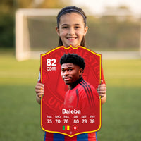 Kid holding the Carlos Baleba Manchester United FC27 football card