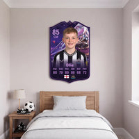 Purple FC27 Future Stars custom card mounted above a junior footballer's bed