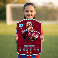 Kid holding the Johan Manzambi Aston Villa FC27 football card